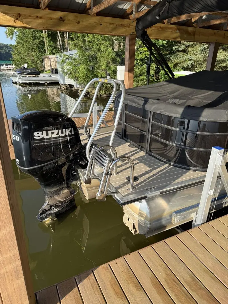 Pontoon stern and outboard motor before detailing