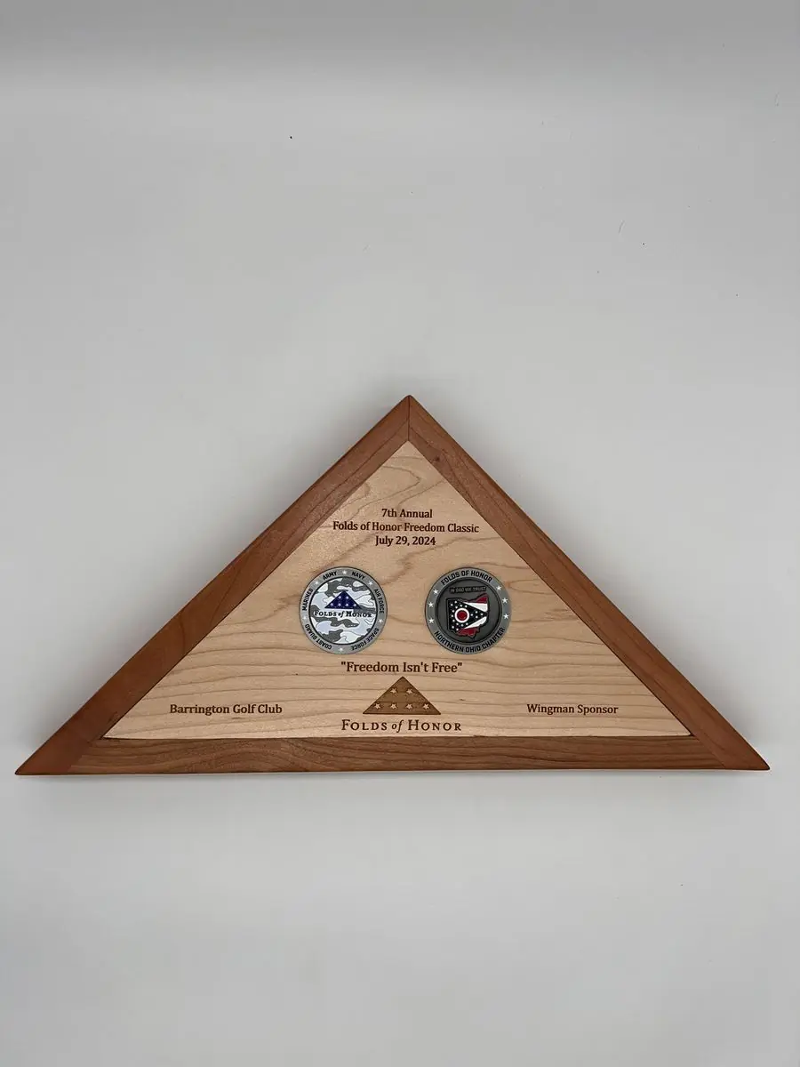 Triangular wooden flag case with two challenge coins and engraved event text